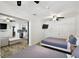 Bedroom with twin beds, and view of kitchen and living area at 1906 2Nd St, Indian Rocks Beach, FL 33785