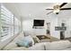 Bright living room featuring white sectional sofa and wood-look floors at 1906 2Nd St, Indian Rocks Beach, FL 33785