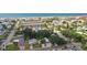 Aerial view of a beachside neighborhood, featuring houses and lush greenery at 1906 2Nd St, Indian Rocks Beach, FL 33785