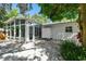 Outdoor oasis with patio, sunroom, and shower, perfect for relaxation at 1906 2Nd St, Indian Rocks Beach, FL 33785