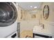 Laundry room with washer, dryer, and additional sink at 1738 San Mateo Dr, Dunedin, FL 34698