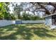 Large backyard with grassy area and storage shed at 3405 E 33Rd Ave, Tampa, FL 33610