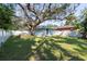Large backyard with shed and mature oak tree at 3405 E 33Rd Ave, Tampa, FL 33610