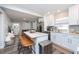 Open concept kitchen with island, stainless steel appliances, and white shaker cabinets at 3405 E 33Rd Ave, Tampa, FL 33610