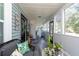 Spacious front porch, perfect for relaxing and enjoying the outdoors at 3405 E 33Rd Ave, Tampa, FL 33610