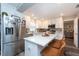 Modern kitchen with white cabinets, stainless steel appliances, and a large island at 3405 E 33Rd Ave, Tampa, FL 33610