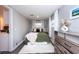 Comfortable bedroom with a bed, dresser, and large window providing natural light at 3405 E 33Rd Ave, Tampa, FL 33610