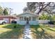 House exterior showcasing a light blue home at 3405 E 33Rd Ave, Tampa, FL 33610