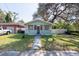 Nice curb appeal with light blue house exterior at 3405 E 33Rd Ave, Tampa, FL 33610