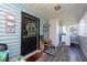 Inviting front porch with ample seating and screened enclosure at 3405 E 33Rd Ave, Tampa, FL 33610