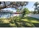 Backyard with shed, large tree, and privacy fence at 3405 E 33Rd Ave, Tampa, FL 33610