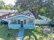 Cute light blue house with a screened porch and a fenced backyard at 3405 E 33Rd Ave, Tampa, FL 33610