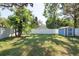 Spacious backyard with grassy lawn, shed, and privacy fence at 3405 E 33Rd Ave, Tampa, FL 33610
