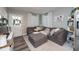 Cozy living room featuring a sectional sofa and ample natural light at 3405 E 33Rd Ave, Tampa, FL 33610