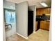 Open kitchen features a breakfast bar and view into living area at 724 Haven Pl, Tarpon Springs, FL 34689