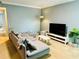 Living room with sectional sofa and TV at 724 Haven Pl, Tarpon Springs, FL 34689