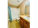 Clean bathroom with a tub, shower, and vanity at 724 Haven Pl, Tarpon Springs, FL 34689