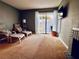 Living room with comfortable seating and access to a patio at 724 Haven Pl, Tarpon Springs, FL 34689