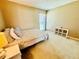 Bright bedroom with a double bed and large window at 724 Haven Pl, Tarpon Springs, FL 34689