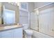 Clean bathroom with a tub/shower combo and white vanity at 20920 Eustis Rd, Land O Lakes, FL 34637