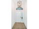 Bright and airy entryway with tiled floor and modern light fixture at 1439 Hickory Moss Pl, Trinity, FL 34655