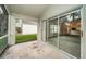 Screened porch with view of the living room and backyard at 1439 Hickory Moss Pl, Trinity, FL 34655