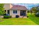 Spacious backyard with screened patio, grill, and lush lawn at 2001 Palm Key Ave, Oldsmar, FL 34677