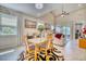 Bright dining area with glass table and access to the living room at 2001 Palm Key Ave, Oldsmar, FL 34677