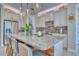 Modern kitchen with granite countertops and island seating at 2001 Palm Key Ave, Oldsmar, FL 34677