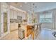 Spacious kitchen with island, stainless steel appliances, and ample cabinet storage at 2001 Palm Key Ave, Oldsmar, FL 34677