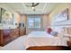 Bright main bedroom with king-size bed and large window at 2001 Palm Key Ave, Oldsmar, FL 34677