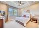 Bright main bedroom with king-size bed and large window at 2001 Palm Key Ave, Oldsmar, FL 34677