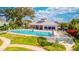 Community pool and cabana area with ample seating and a well-manicured lawn at 2001 Palm Key Ave, Oldsmar, FL 34677