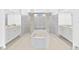 Luxurious bathroom with soaking tub, walk-in showers, and dual vanities for added convenience at 7925 Royal Queensland Way, Lakewood Ranch, FL 34202