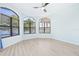 Serene bedroom with hardwood floors and multiple windows at 7925 Royal Queensland Way, Lakewood Ranch, FL 34202