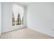 Bright bedroom with wood floors, a large window, and neutral walls at 7925 Royal Queensland Way, Lakewood Ranch, FL 34202