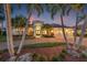 Stunning home with a circular driveway and a three-car garage at 7925 Royal Queensland Way, Lakewood Ranch, FL 34202