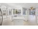 Bright kitchen with a central island, an abundance of cabinet space, and access to the pool at 7925 Royal Queensland Way, Lakewood Ranch, FL 34202