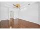 Spacious room with hardwood floors, tray ceiling, and archway entrance exudes elegance at 7925 Royal Queensland Way, Lakewood Ranch, FL 34202