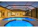 Enjoy this home's relaxing private pool and screened in patio under the sunset sky at 7925 Royal Queensland Way, Lakewood Ranch, FL 34202