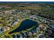 Aerial view of houses surrounding a tranquil lake at 8518 Tidal Bay Ln, Tampa, FL 33635