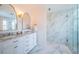 Elegant bathroom with double vanity and marble shower at 8518 Tidal Bay Ln, Tampa, FL 33635