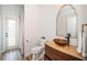 Bathroom with modern vanity, vessel sink, and walk-in shower at 8518 Tidal Bay Ln, Tampa, FL 33635