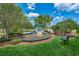 Community playground with playset and bench at 8518 Tidal Bay Ln, Tampa, FL 33635