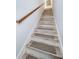 Modern staircase with light wood and neutral tones at 8518 Tidal Bay Ln, Tampa, FL 33635