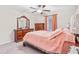 Cozy bedroom with a queen bed and dresser at 12941 Wildflower Meadow Dr, Riverview, FL 33579