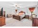 Spacious Primary bedroom with a large bed and plenty of natural light at 12941 Wildflower Meadow Dr, Riverview, FL 33579