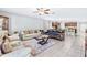 Open living room with comfortable seating and access to backyard at 12941 Wildflower Meadow Dr, Riverview, FL 33579