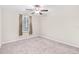 Simple bedroom with ceiling fan and neutral wall color at 12941 Wildflower Meadow Dr, Riverview, FL 33579