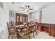 Dining room featuring a large wooden table with six chairs at 12941 Wildflower Meadow Dr, Riverview, FL 33579